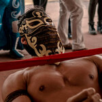Lucha Libre wrestlers and a band performing at a vaccination center in Mexico City.